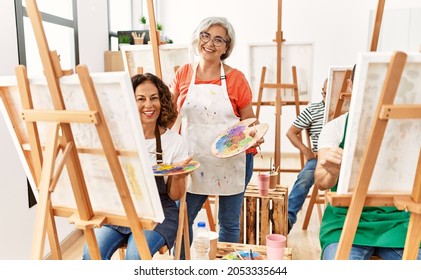 Group Of Middle Age Draw Students Drawing At Art Studio. Teacher And Student Woman Smiling Happy Looking To The Camera.