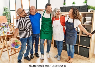 Group of middle age draw students smiling happy and hugging at art studio. - Powered by Shutterstock