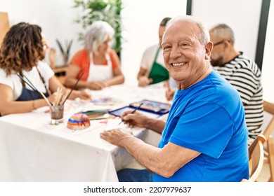 Group of middle age draw students sitting on the table drawing at art studio. Man smiling happy looking to the camera. - Powered by Shutterstock