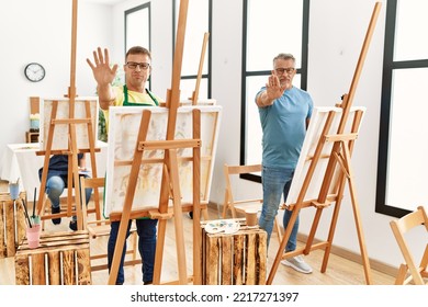 Group Of Middle Age People Artist At Art Studio With Open Hand Doing Stop Sign With Serious And Confident Expression, Defense Gesture 