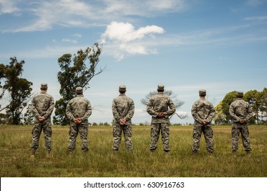 Group Of Military Soldiers Standing In Line At Boot Camp