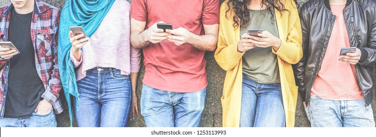 Group of millennial friends watching social stories on smart mobile phones - People addiction to new technology trends - Concept of youth, texting, social and friendship - Main focus on center hands