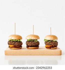 a group of mini burgers on a wooden board
