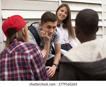 Group Of Modern Teens Talking In The Yard