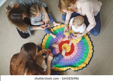 Group Of Mothers With Babies In A Lesson At A Kindergarten Center, Montessori Kindergarten Mom And Baby, Caucasian Women With Children