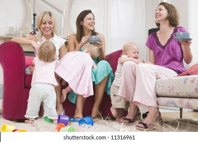 Group Of Mothers Playing At Home With Toddlers