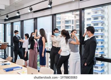 Group Of Multi Ethnic Business Coworker Wearing Face Mask Greeting With Elbow Bump In New Normal Office During Pandemic Of Covid-19