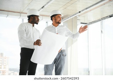 Group of multi ethnic engineer construction site worker meeting at workplace.