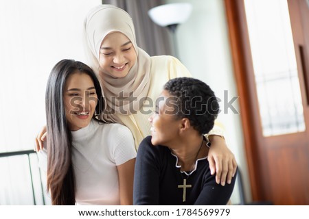 A group of multi ethnic friends, multi racial women with different religions; concept of people with diversity and inclusivity