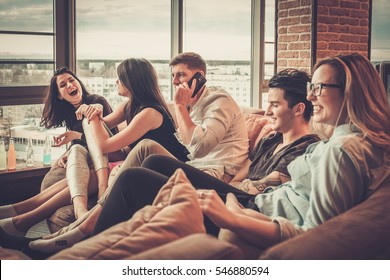 Group Of Multi Ethnic Young Friends Having Fun In Home Interior