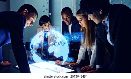 Group of multi racial people watching hologram display. Global business. Management strategy. Science technology. Sustainable development goals. SDGs. - Shutterstock ID 2075946454