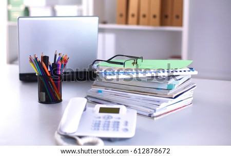 Group of multicolored office folders and glasses