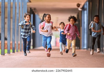Group Of Multi-Cultural Elementary School Pupils Running Along Walkway Outdoors At School - Shutterstock ID 2267902645