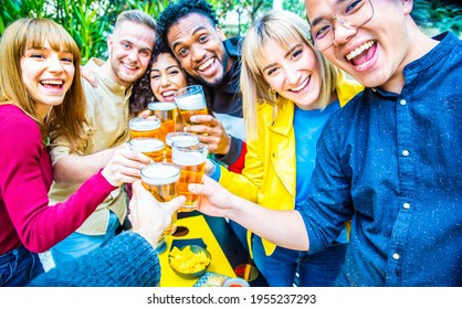 Group Of Multicultural Friends Drinking And Toasting Beer At Brewery Bar Restaurant - Happy People Having Fun At Rooftop Home Party - Vivid Color Filter