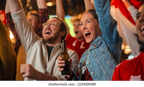 Group of Multicultural Friends Watching a Live Soccer Match in a Sports Bar. Focus on Beautiful Female. Young People Celebrating When Team Scores a Goal and Wins the Football World Cup. - Powered by Shutterstock