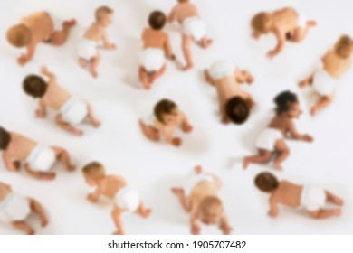 Group Of Multiethnic Babies Crawling Isolated On White Background