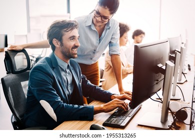Group of multiethnic business people working at busy modern office - Shutterstock ID 1955313265
