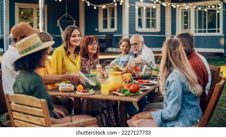 Group of Multiethnic Diverse People Having Fun, Communicating with Each Other and Eating Vegetarian Meals at an Outdoors Dinner. Relatives and Friends Gathered Outside Their Home on Warm Summer Day. - Powered by Shutterstock