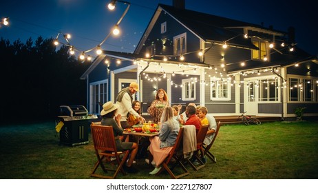 Group of Multiethnic Diverse People Having Fun, Sharing Stories with Each Other and Eating at Outdoors Dinner Party. Family and Friends Gathered Outside Their Home on a Warm Summer Evening. - Shutterstock ID 2227127807