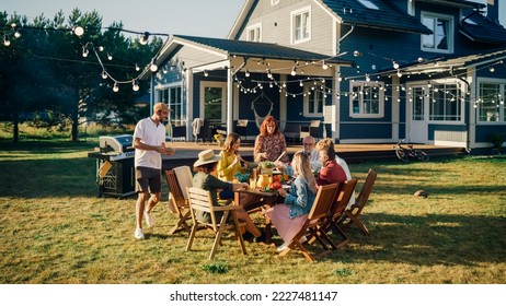 Group of Multiethnic Diverse People Having Fun, Communicating with Each Other and Eating at Outdoors Dinner. Family and Friends Gathered Outside Their Home on Warm Summer Day. - Powered by Shutterstock