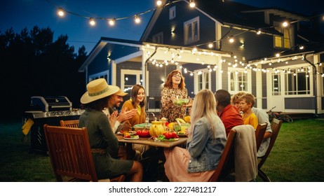 Group of Multiethnic Diverse People Having Fun, Communicating with Each Other and Eating at Outdoors Dinner. Family and Friends Gathered Outside Their Home on a Warm Summer Evening. - Shutterstock ID 2227481217