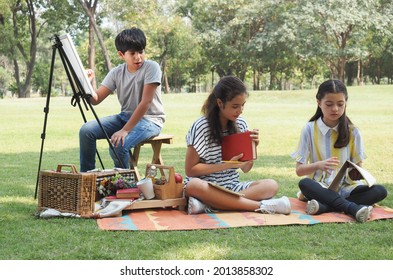 Group Of Multi-ethnic Kids Plays Together In The Park, Concept Of Education Outside Of School.