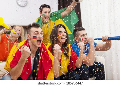 Group of multi-ethnic people celebrating football game - Powered by Shutterstock