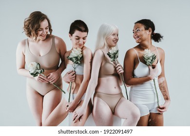 Group Of Multiethnic Women With Different Kind Of Skin Posing Together In Studio. Concept About Body Positivity And Self Acceptance