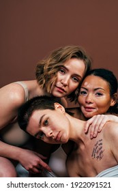 Group Of Multiethnic Women With Different Kind Of Skin Posing Together In Studio. Concept About Body Positivity And Self Acceptance