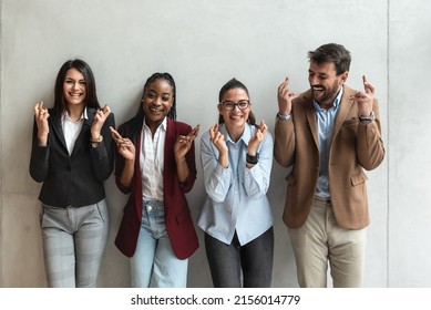 Group Of Multiethnic Young Business Freelance People Hopeful Crossing Their Fingers Hoping, Asking For Best. Human Success Face Expressions, Emotions, Feelings Attitude Reaction