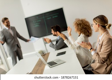 Group of multiethnic young business people working together in the office - Shutterstock ID 1878267151