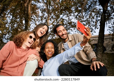 Group of multi-ethnic young people taking a happy smiling selfie. Beautiful woman shoot a photo with a friends. High quality photo - Shutterstock ID 2280117849