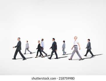 Group Of Multi-ethnical Business People Walking In A White Background.