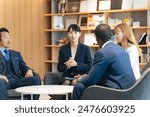 Group of multinational business people having a conversation in a lobby