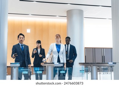 Group of multinational business people passing through a security gate - Powered by Shutterstock