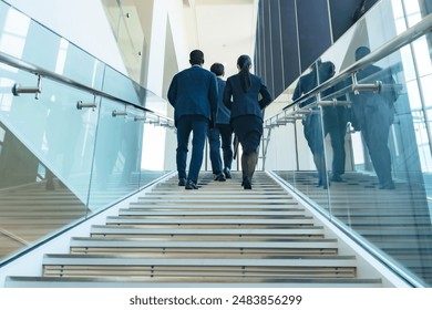 A group of multinational business people walking up the stairs - Powered by Shutterstock