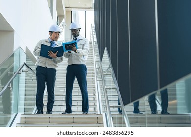 Group of multinational engineers having a conversation in a facility