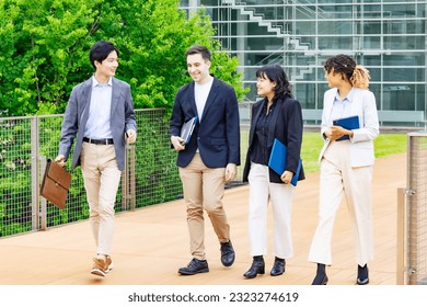 Group of multinational people walking on street. International business. - Shutterstock ID 2323274619