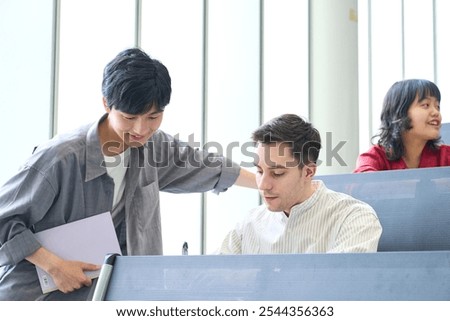 Group of multinational students having a conversation in a classroom