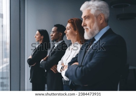 Group of multiracial businesspeople standing with arms crossed
