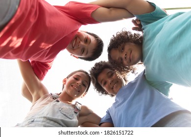 Group Of Multiracial Children Hugging Each Other. White, Black Child With Down Syndrome. Children's Day Concept