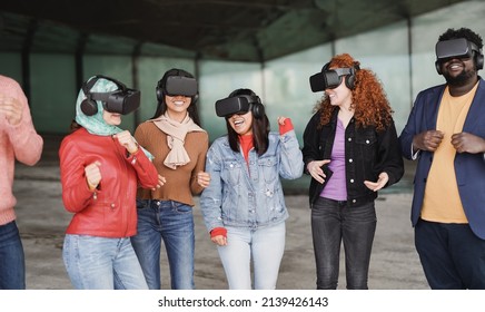 Group of multiracial friends dancing in the city while wearing virtual reality headset - Powered by Shutterstock