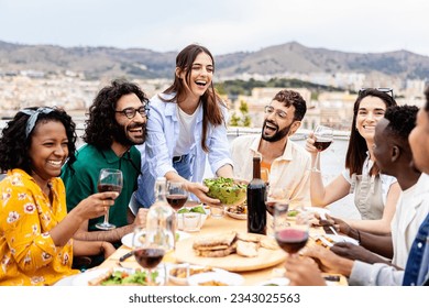 Group of multiracial friends enjoying summer barbecue dinner party at home terrace.  - Powered by Shutterstock