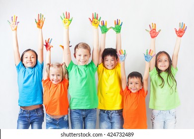 Group Of Multiracial Funny Children. Funny Kids Hands Up.