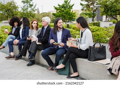 Group Of Multiracial People Eating Together During Lunch Break Outside Of Office