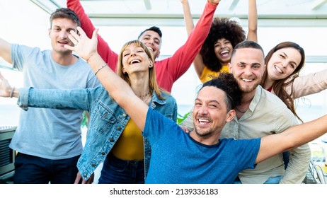 Group Of Multiracial People With Hands Up Smiling At Camera Together - Corporate Team Colleagues Congratulating Coworker With Business Success In Coworking Shared Office