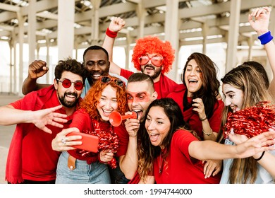 Group Of Multiracial Supporter Sport Fans Taking Selfie With Mobile Phone While Supporting Their Football Team - Young People Having Fun Outside The Stadium After Sport Event - Entertainment Concept