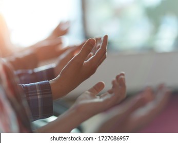 group of muslim people praying namaz  in mosque together closeup on hands - Shutterstock ID 1727086957