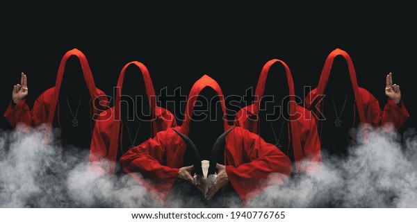 Group of mysterious figures in hooded cloaks\
in the dark. Leader of sectarians holds skull with horns. Horror\
scene with smoke. Black\
background.