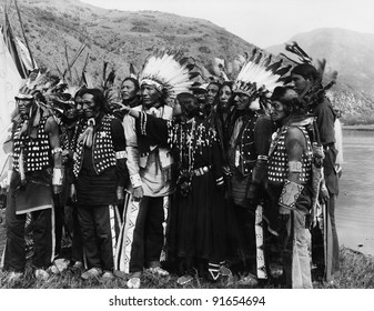 Group of Native Americans in traditional garb - Shutterstock ID 91654694